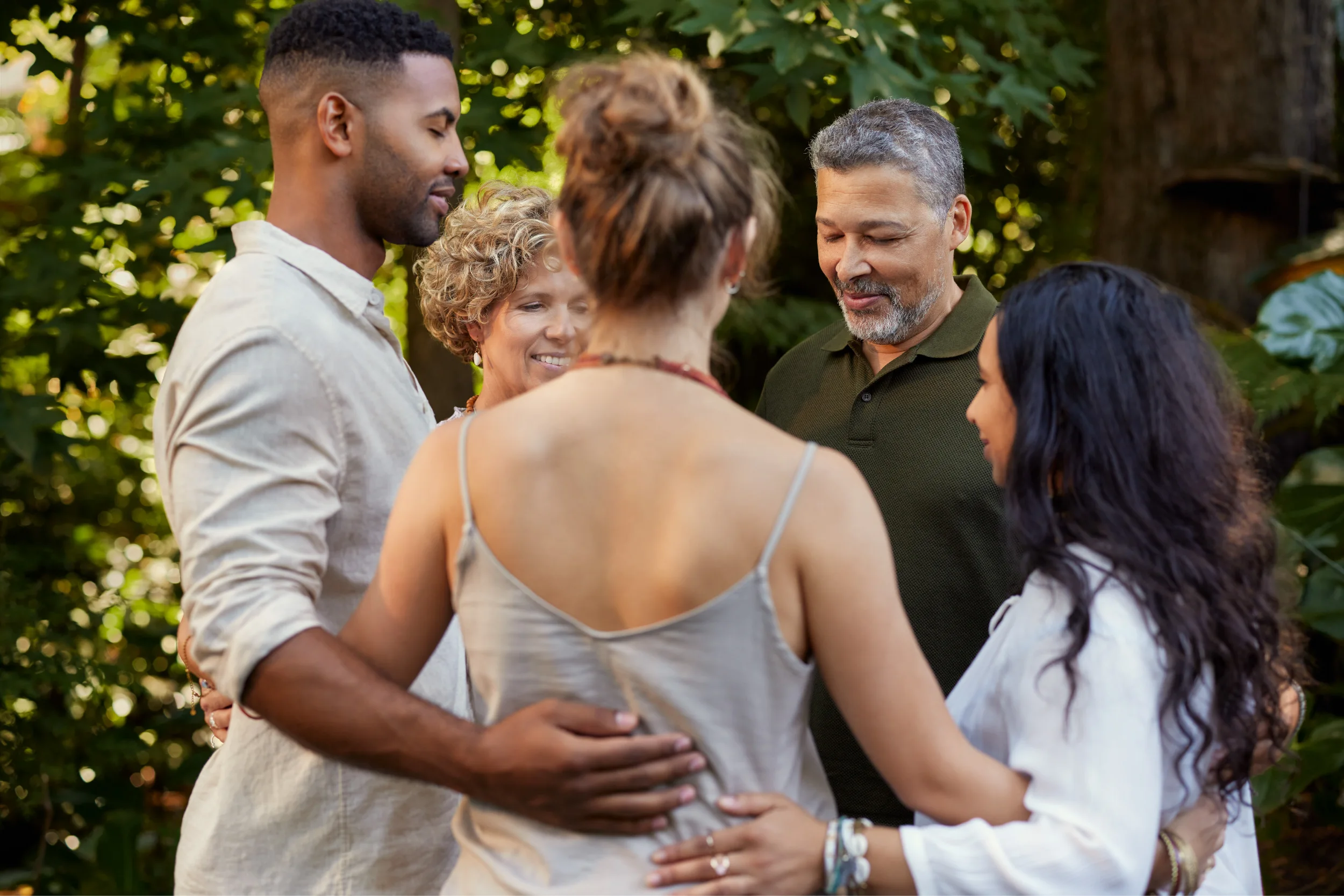Gina-Program-Other-3-01 Participants sharing a supportive group moment during an outdoor in-person retreat experience